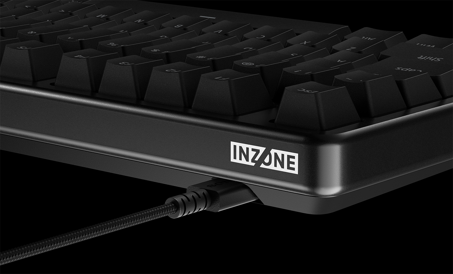 Side view of INZONE KBD-H75 keyboard with coiled cable