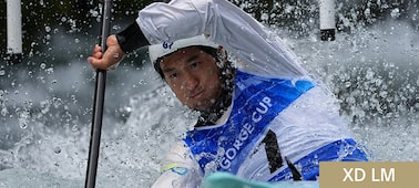 Close-up of a kayaker paddling through splashing white water