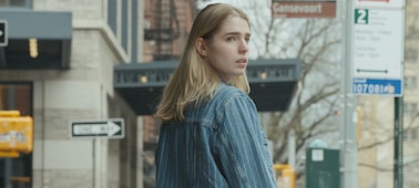 Example image of a woman in the street, looking over her shoulder