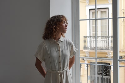 Example image showing profile portrait of a woman in a room next to a sunlit window