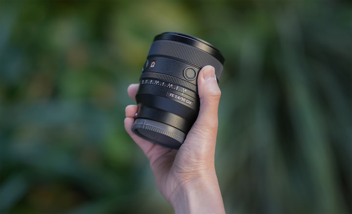 Lens being carried by hand
