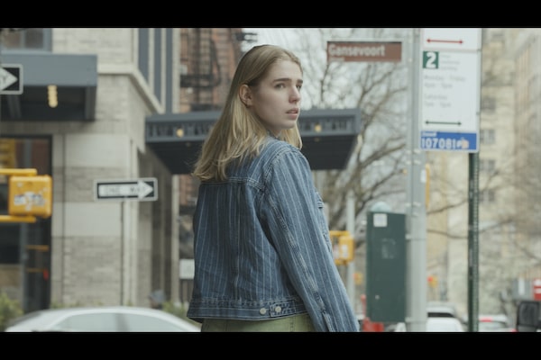 Example image of a woman in the street, looking over her shoulder