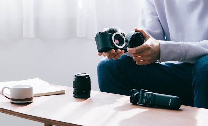 Picture of a person changing the lens