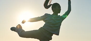 Example image from a slow-motion video showing a woman's hair flying
